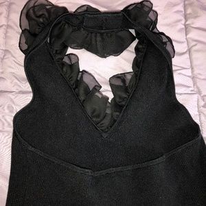 Backless knit top/blouse with ruffles. Black. L.